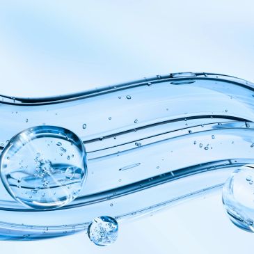 Abstract water droplets and waves on a blue background.