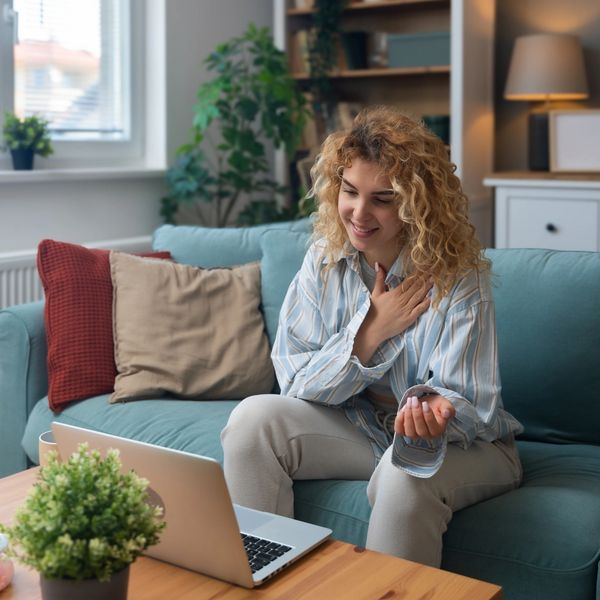 young lady in a telehealth therapy session with live well therapy of salina
