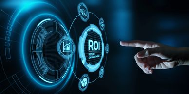 Hand interacting with futuristic digital ROI interface.