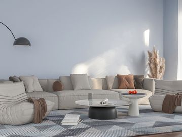 Modern living room with neutral furniture and soft natural light.