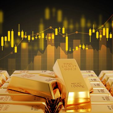 Gold bars with financial graph background.