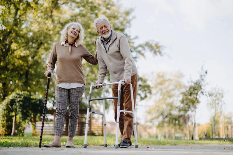 Elderly Couple Enjoys a Leisurely Walk in the Park