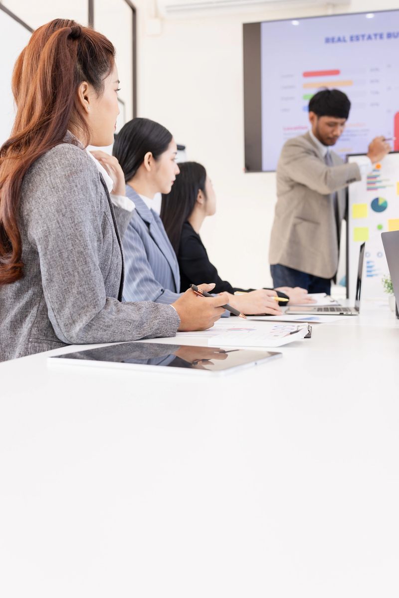 Business teamwork presented and brainstorming concept, Group of business people working together with dashboard analysis and data management in meeting room.