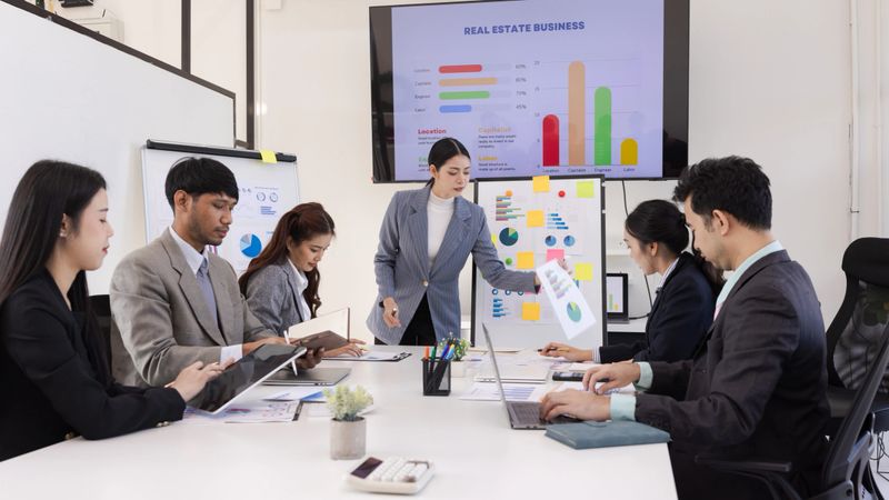 Business teamwork presented and brainstorming concept, Group of business people working together with dashboard analysis and data management in meeting room.