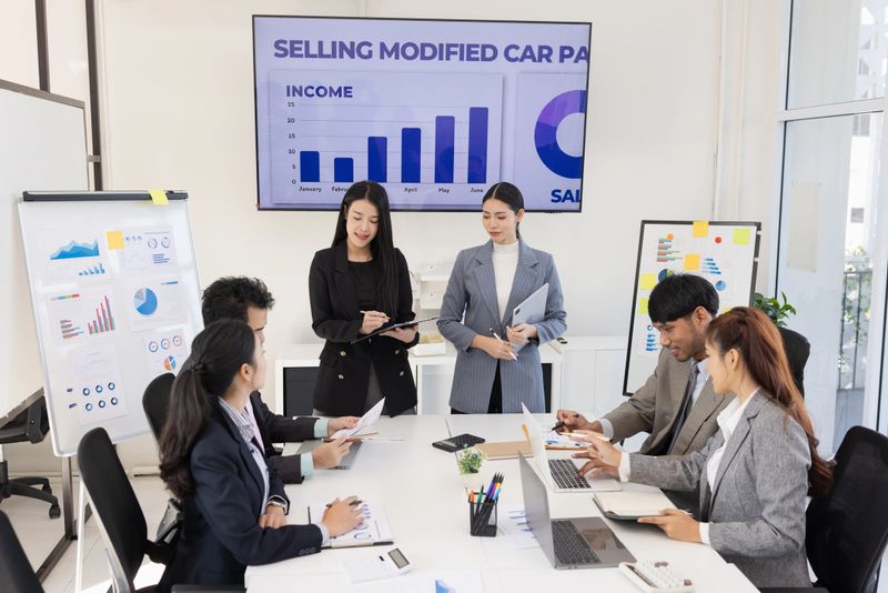 Business teamwork presented and brainstorming concept, Group of business people working together with dashboard analysis and data management in meeting room.