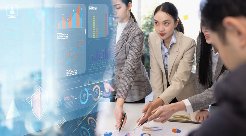 Group of Asian business working plan analysis project brainstorm in modern office, Asian businesspeople team working together, Business startup and company strategy planning concept.