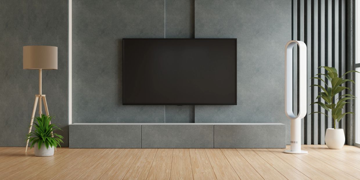 Modern living room with professionally installed wall-mounted television.