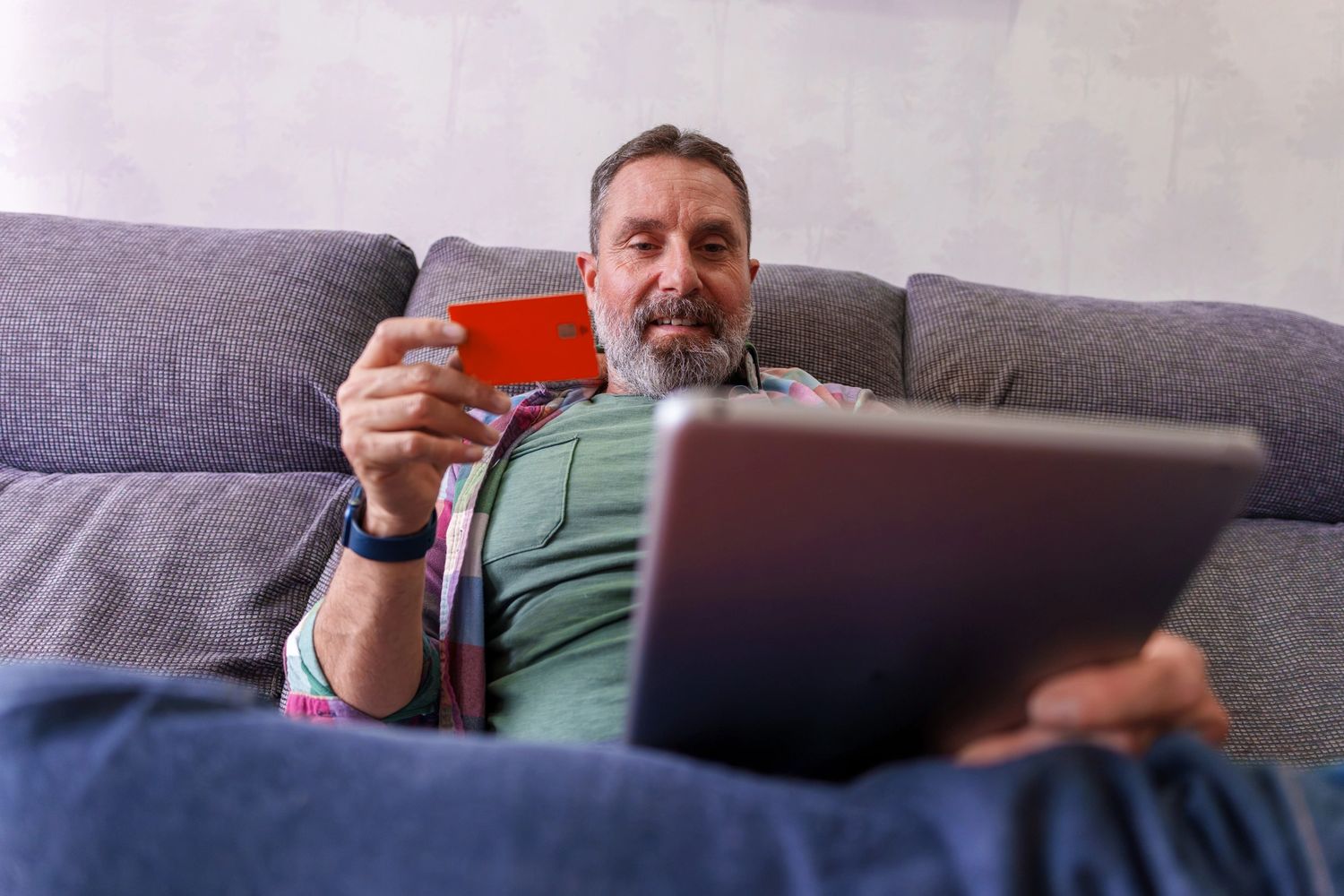Stack of books next to pencils in a holder and a camera.