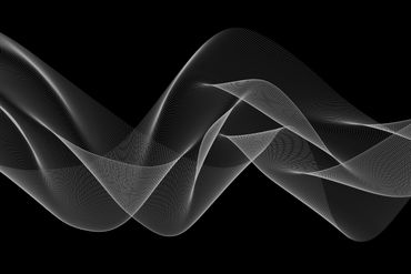 Abstract gray wave pattern on black background.