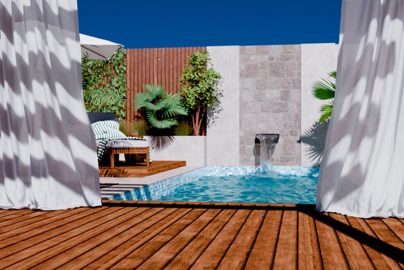 Wooden decking stage with canopy curtains behind luxury swimming pool in modern hotel villa. Tropical home poolside relaxing patio showroom mockup template. Aesthetic desert architecture style.