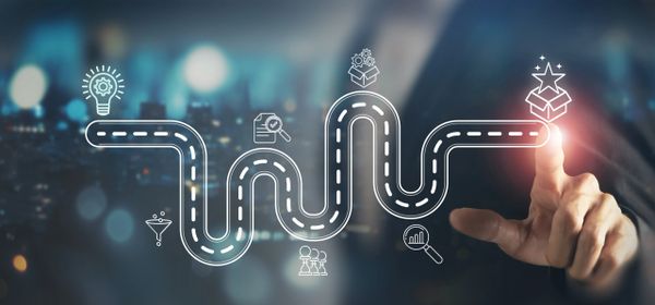 A digital roadmap illustrating innovation and progress with icons and a pointing hand.