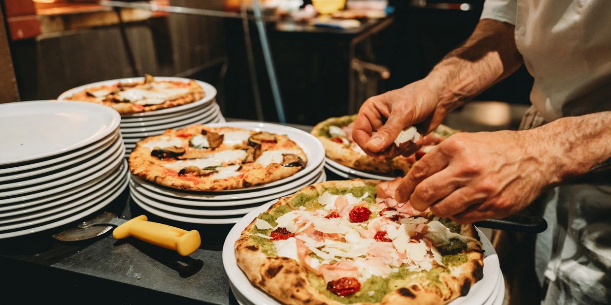 Pizza chef creating a master piece!
