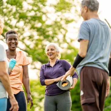 Group of diverse people enjoying outdoor exercise session.