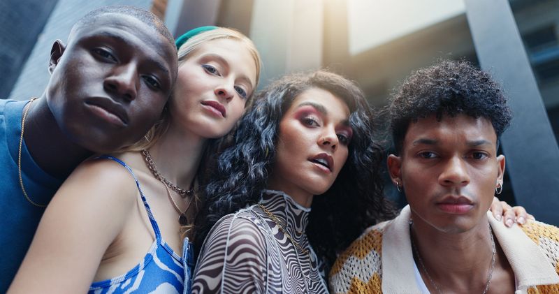 Learning, portrait and student friends in city together for education or scholarship from below. Campus, college or university with serious men and women outdoor for development, future or growth