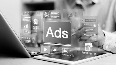 User looking at google ads on computer