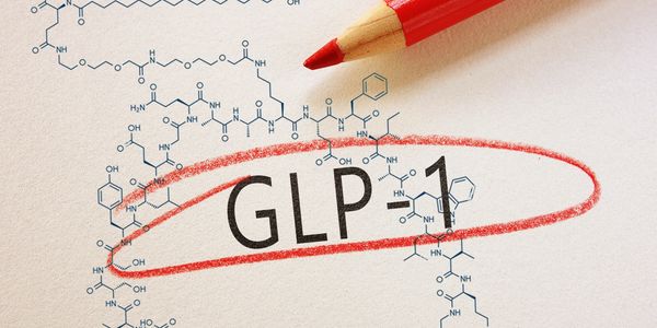 Red pencil circles GLP-1 text on a scientific diagram background.
