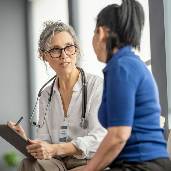 A woman consulting a doctor for her telehealth weight loss.