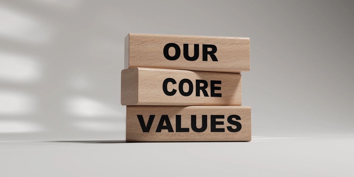 Wooden blocks with text 'OUR CORE VALUES'.