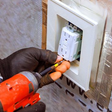 Changing out electrical outlets. 