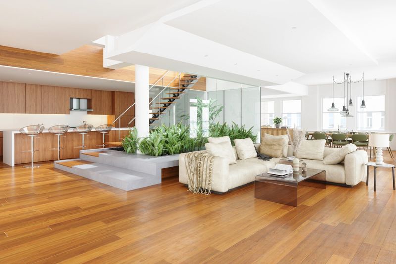 Modern Living Room With Corner Sofa, Dining Table And Chairs, Open Plan Kitchen And Staircase