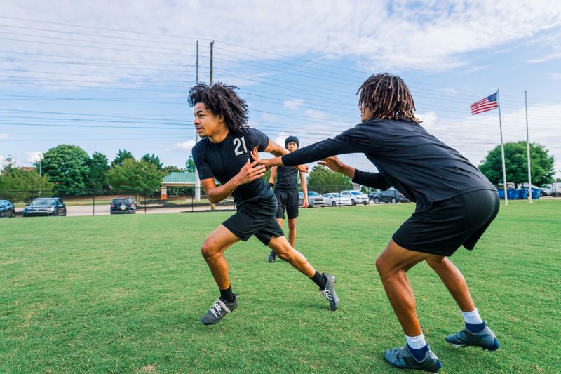 Youth American Flag Football Sports Team Bonding and Practicing Together n Summer