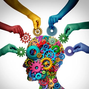 Colorful gears in a head manipulated by multicolored hands.