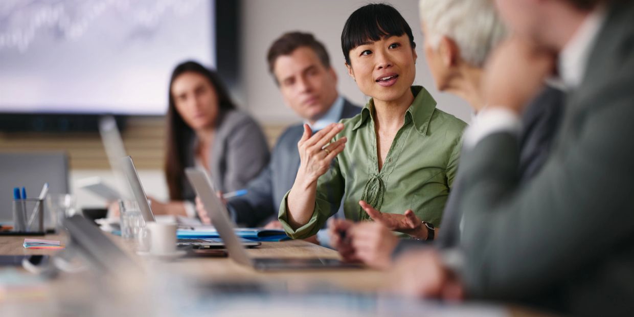 Woman leading a business meeting discussion.