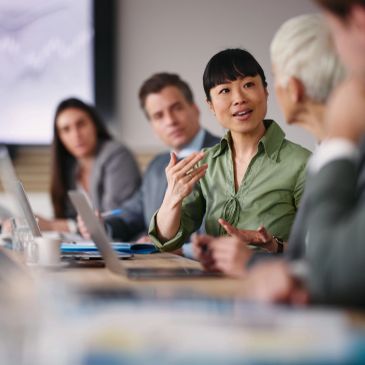 Businesswoman leading a discussion in a meeting.