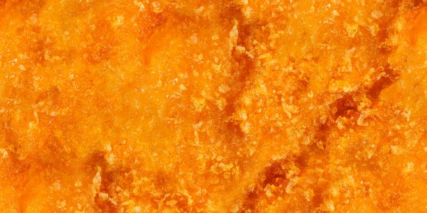 Close-up of crunchy, golden-brown fried food crust.