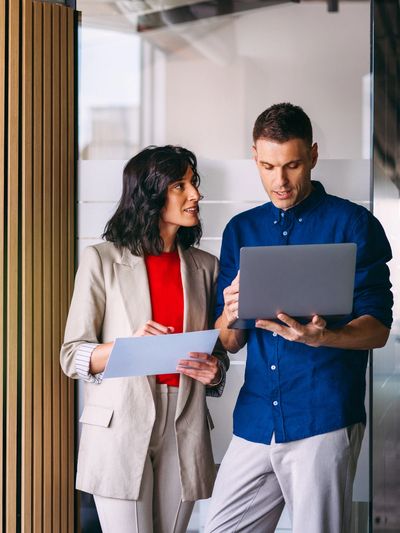 why choose us, senior employee explaining to client