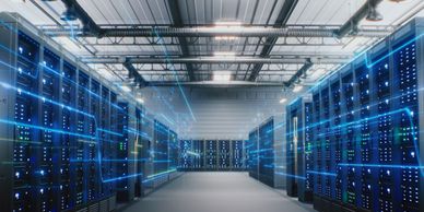 Modern data center with glowing server racks and digital connectivity.