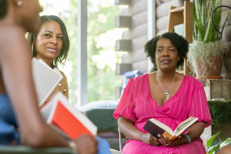 Books, warmth, and laughter create a perfect afternoon for senior women.