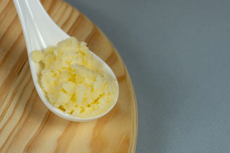 Ghee Butter In A Spoon Copy Space for Text.