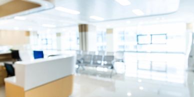 Blurred image of a bright, modern waiting area.