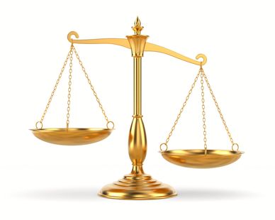 Golden balance scale with one side lower than the other.