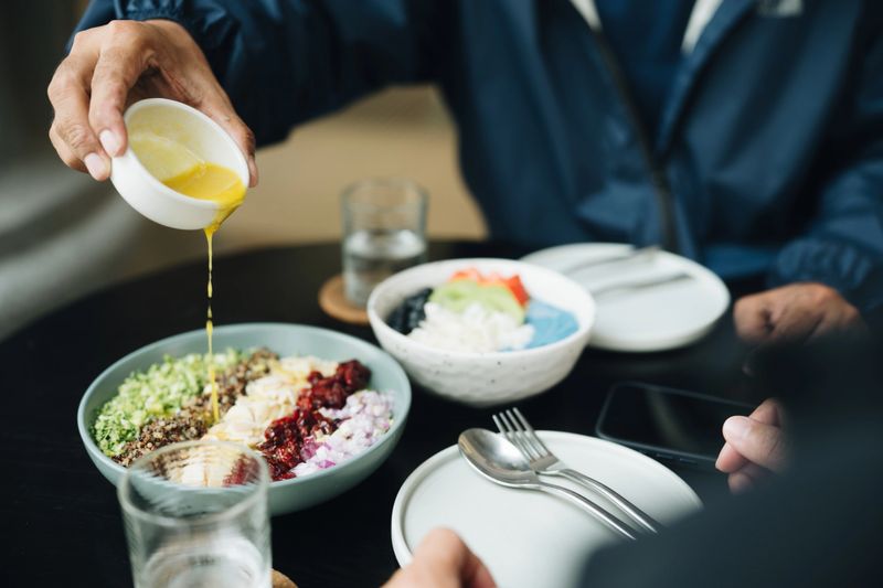Organic quinoa salad served with dressing on the side, packed with plant-based protein, fiber, and essential nutrients, offering a nutritious, customizable meal that supports healthy eating and encourages meaningful connections through shared dining experiences