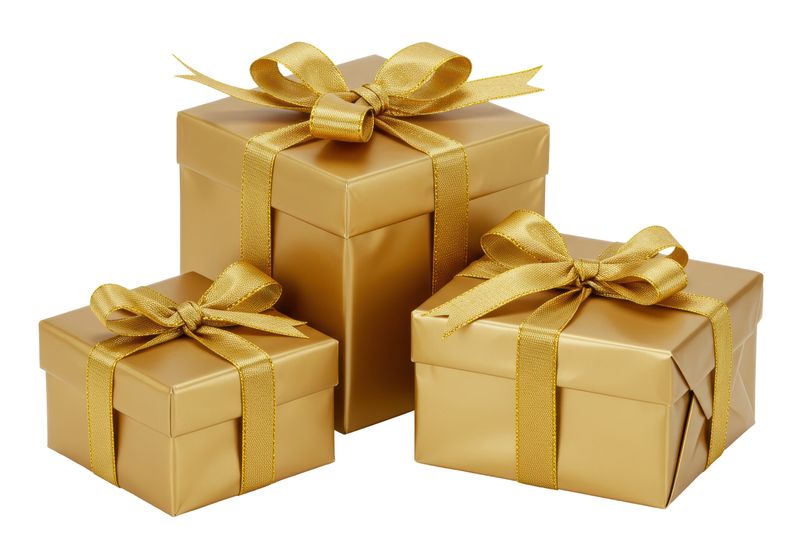 Isolated Stack of Three Golden Gift Boxes with Ribbons