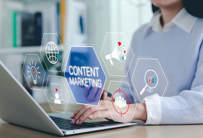 Content Marketing Strategy Concept. Woman using laptop with digital icons content marketing, social media engagement, analytics, and audience targeting tools. Multichannel market, Creative idea,