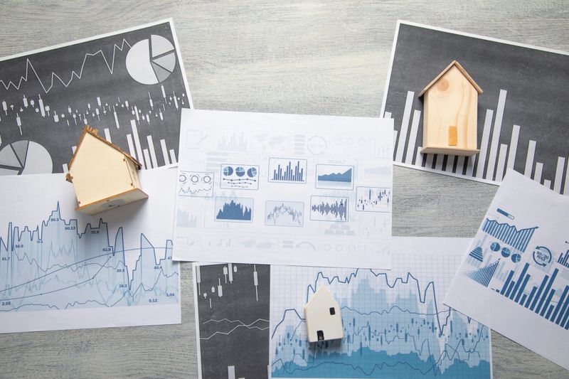 House model on a financial graphs. Real estate. Business