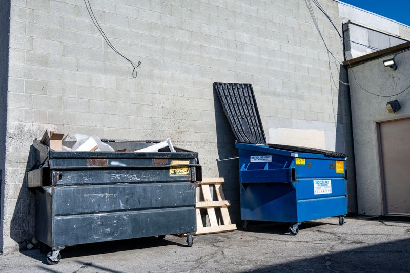 Dumpsters filing up in this alley