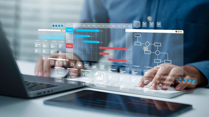 Project management tool concept. Business people use laptop to manager working projects and update task with Gantt chart schedule to Business plan and progress. Planning software.