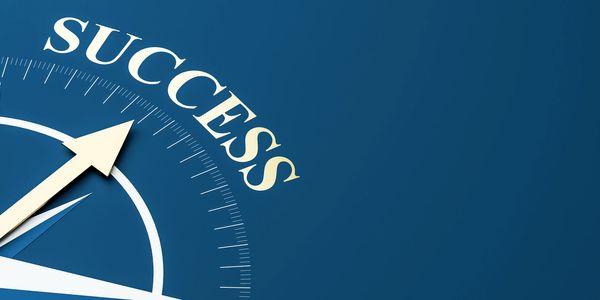 Compass needle pointing to the word 'SUCCESS'.