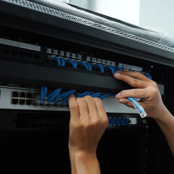 Patch cabling using cable management bar. Neat and clean network rack.