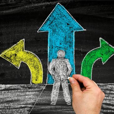 Chalk drawing of a person deciding among three colorful directional arrows.