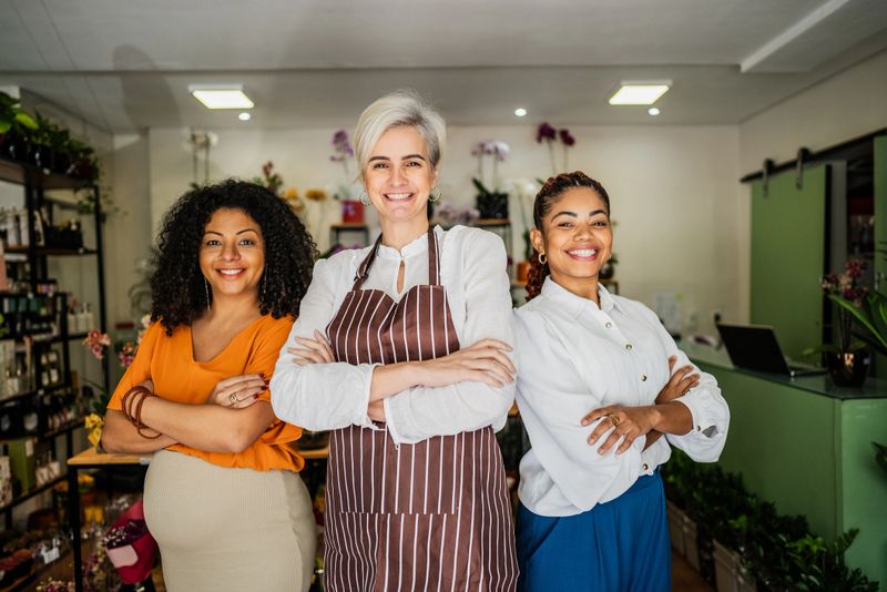 Shop owner and employees at a home decor store
