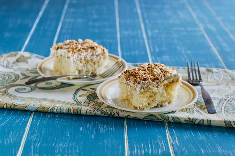 coconut cake topped with toasted coconut shavings
