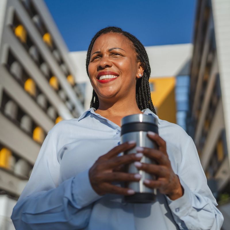 beautiful african american businesswoman enjoy on her coffee break outdoor
