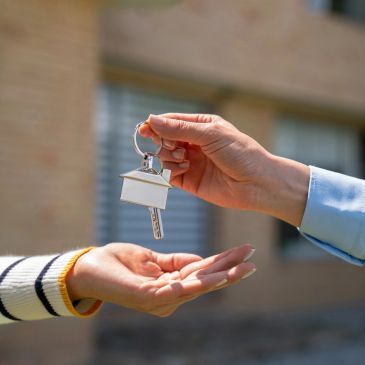 Handing over a house key.
