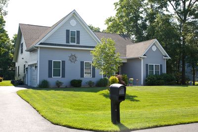 Exterior of a house with a lawn and trees