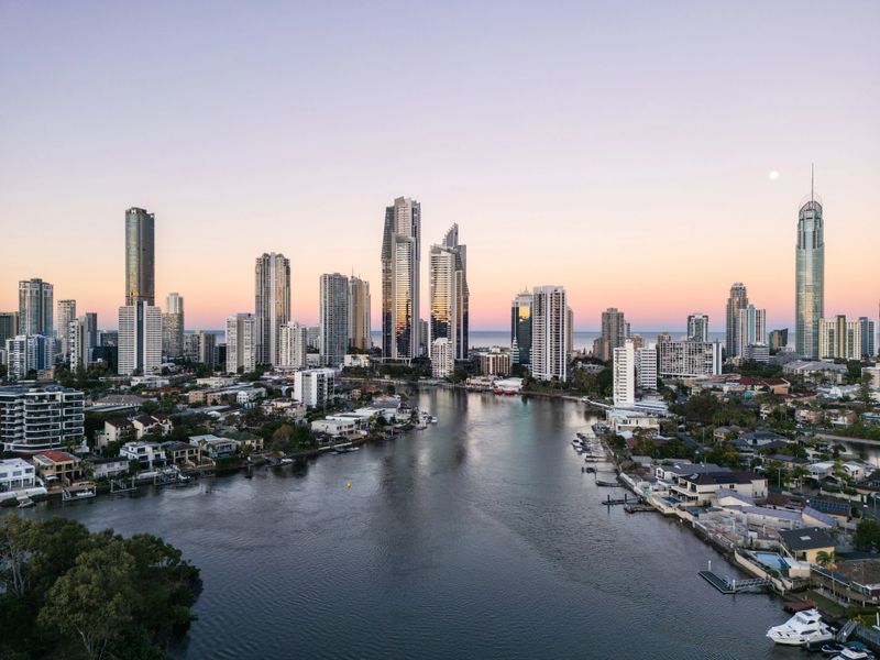 Beautiful dusk aerial view of Surfers Paradise, Gold Coast and waterfront suburbs and canals